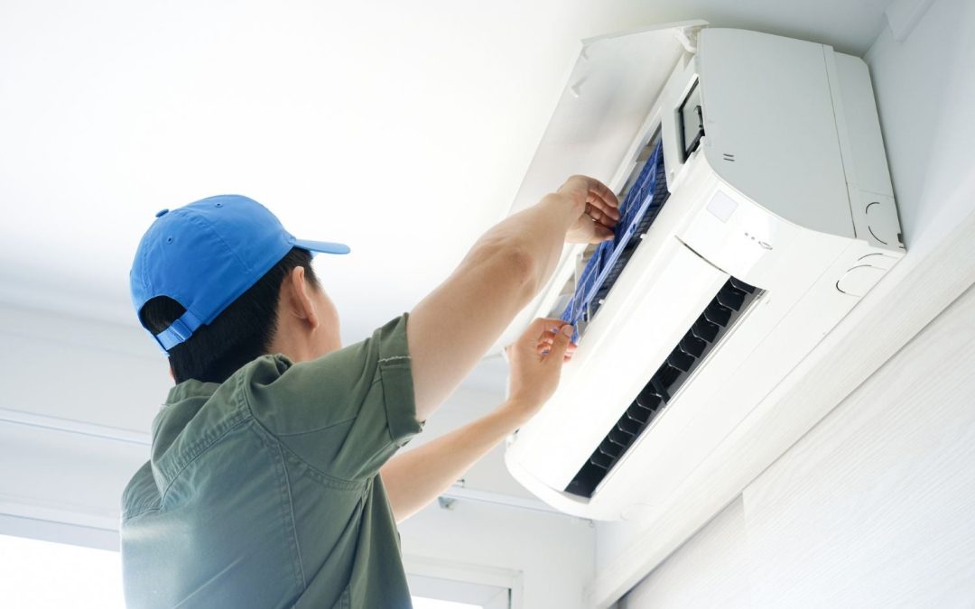HVAC technician servicing a ductless mini split in Monrovia