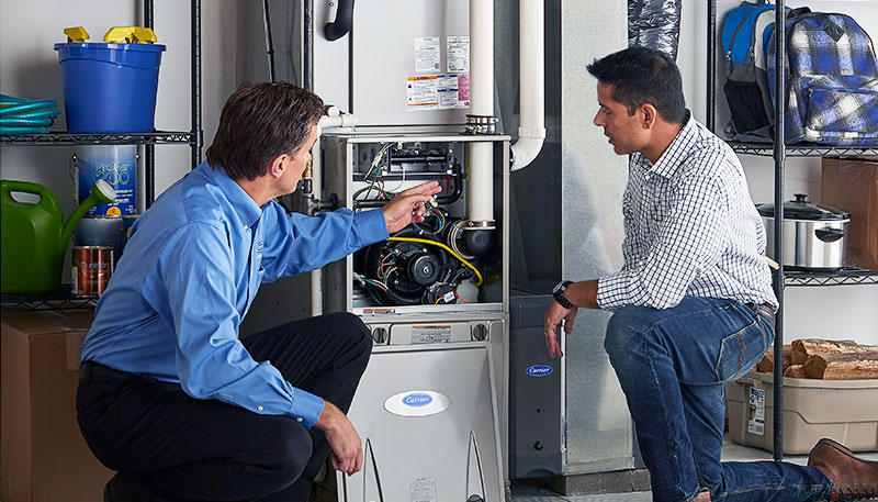 Technician evaluating a furnace for repair or replacement in Monrovia