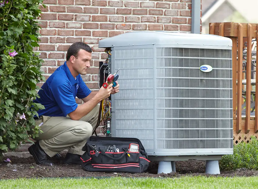 HVAC technician inspecting an outdoor AC unit in Monrovia